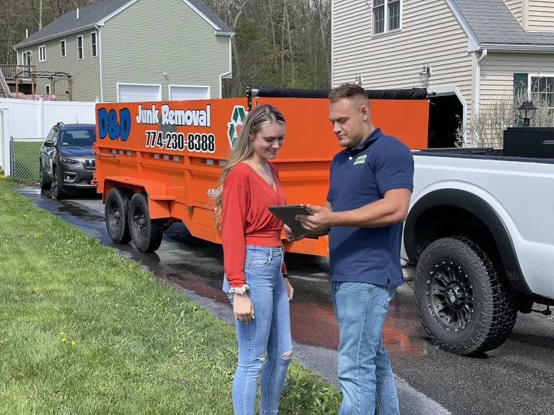 d and d junk removal professional talking to client